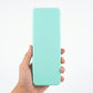 Mint green LCD drawing tablet back view held in hand