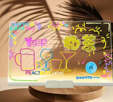 LED drawing board glowing with colorful neon doodle drawings